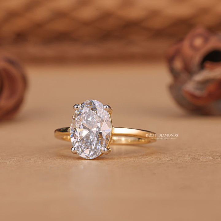 Oval solitaire engagement ring offered in gold and platinum