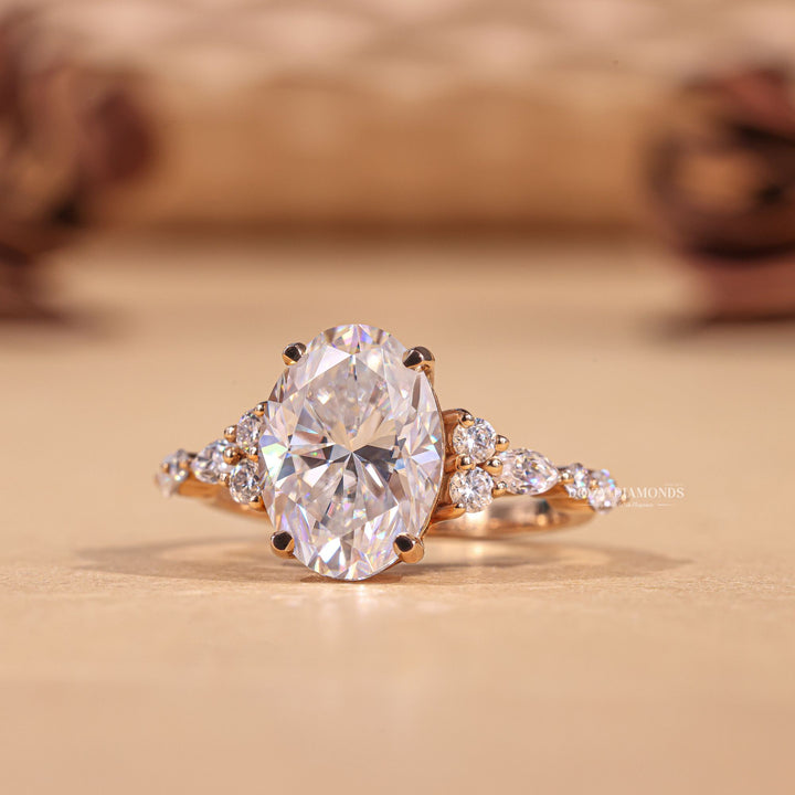 Close-up of oval cut center diamond in cluster engagement ring