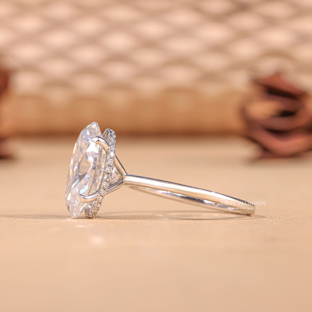 Macro shot of oval cut diamond facets in hidden halo ring setting