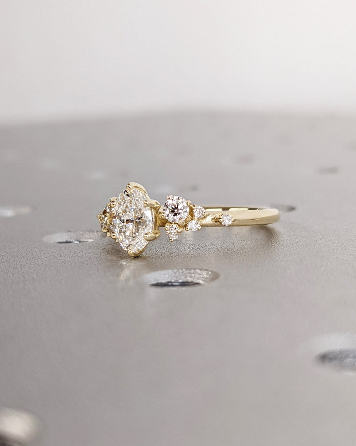Oval cut cluster engagement ring with IGI certified center diamond