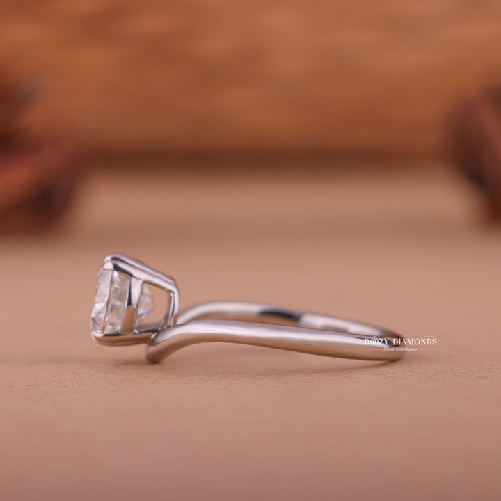 Profile view of oval cut east west engagement ring band