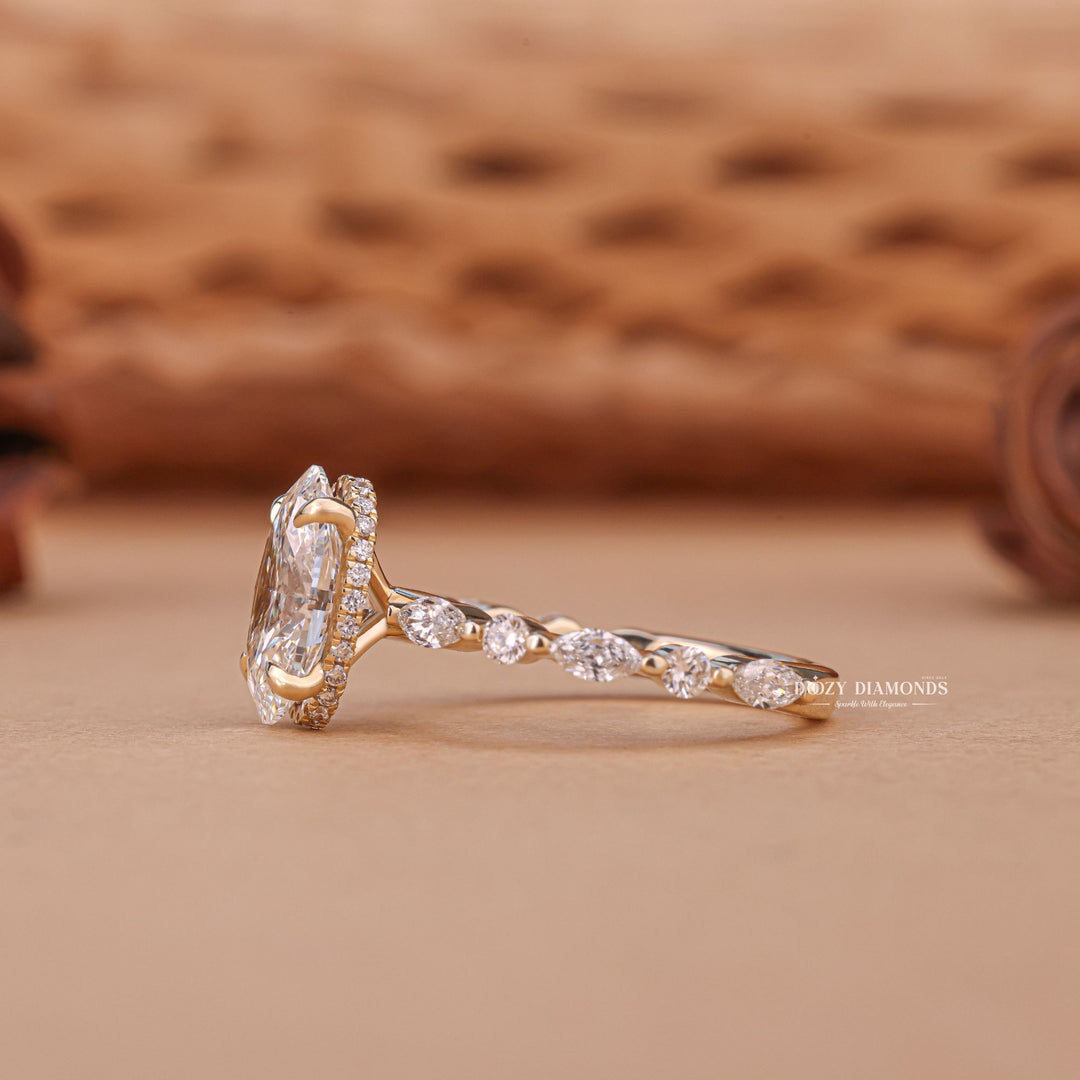 Oval hidden halo engagement ring viewed from the side