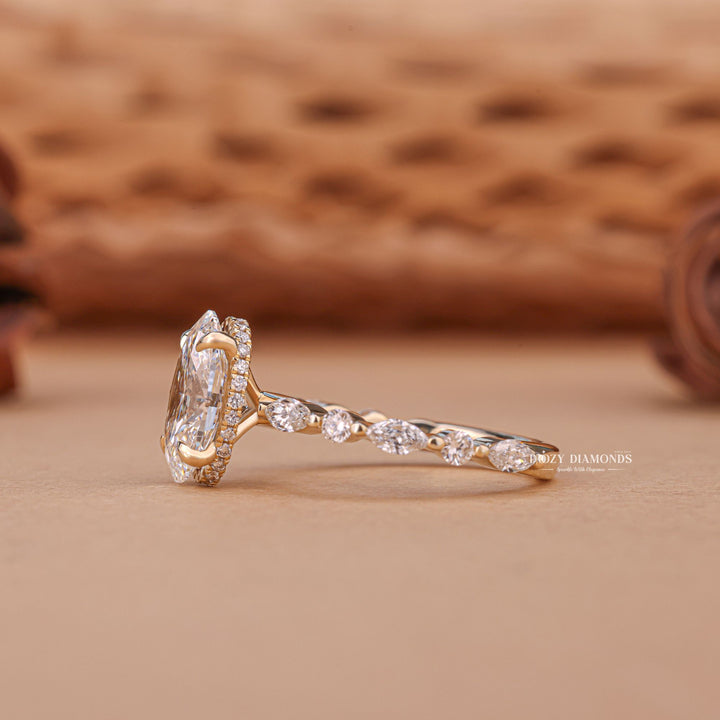 Oval hidden halo engagement ring viewed from the side
