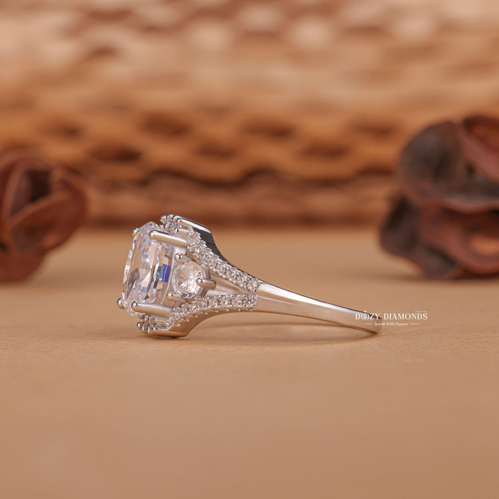 Oval three stone engagement ring close-up showing F/VS1 diamond clarity