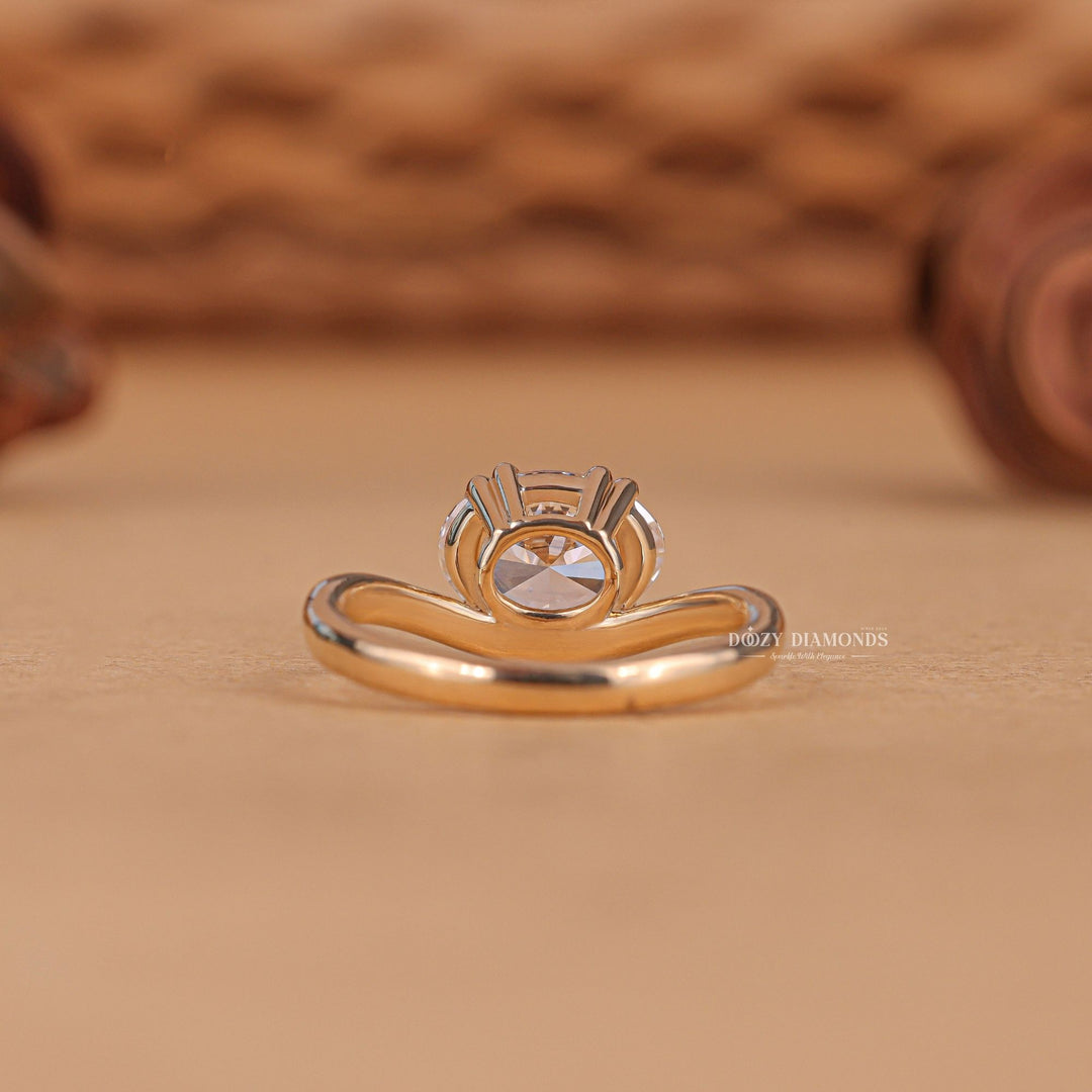 Oval cut diamond ring worn on hand