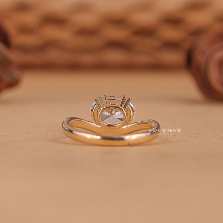Oval cut diamond ring worn on hand