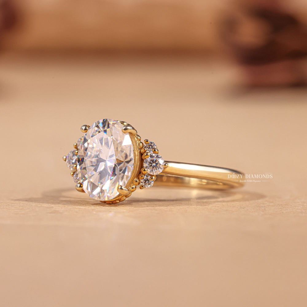Oval cluster engagement ring shown on hand for true-to-life sizing