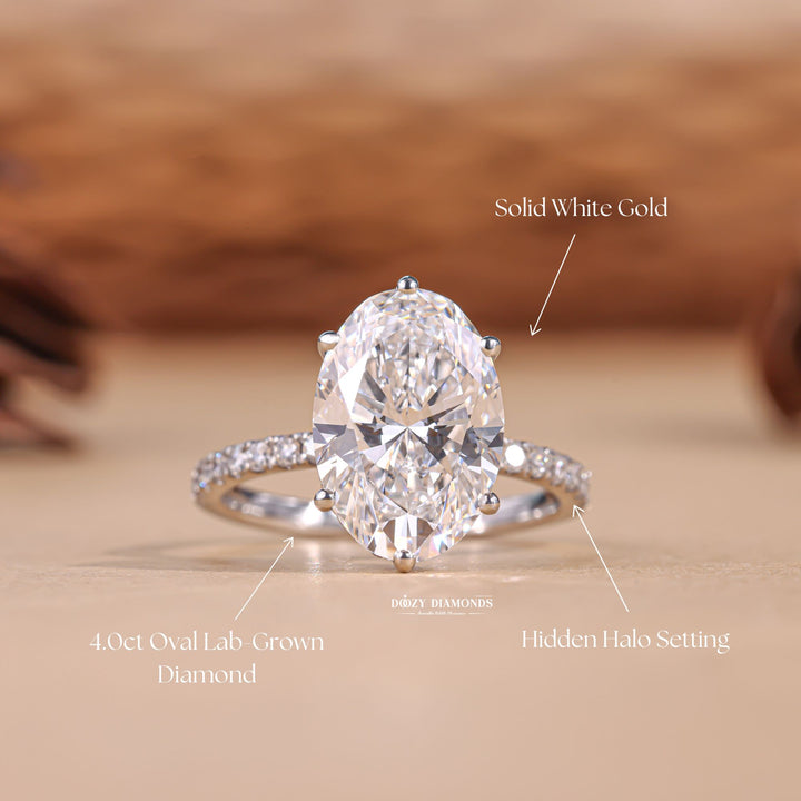 Detailed close-up of oval hidden halo diamond engagement ring
