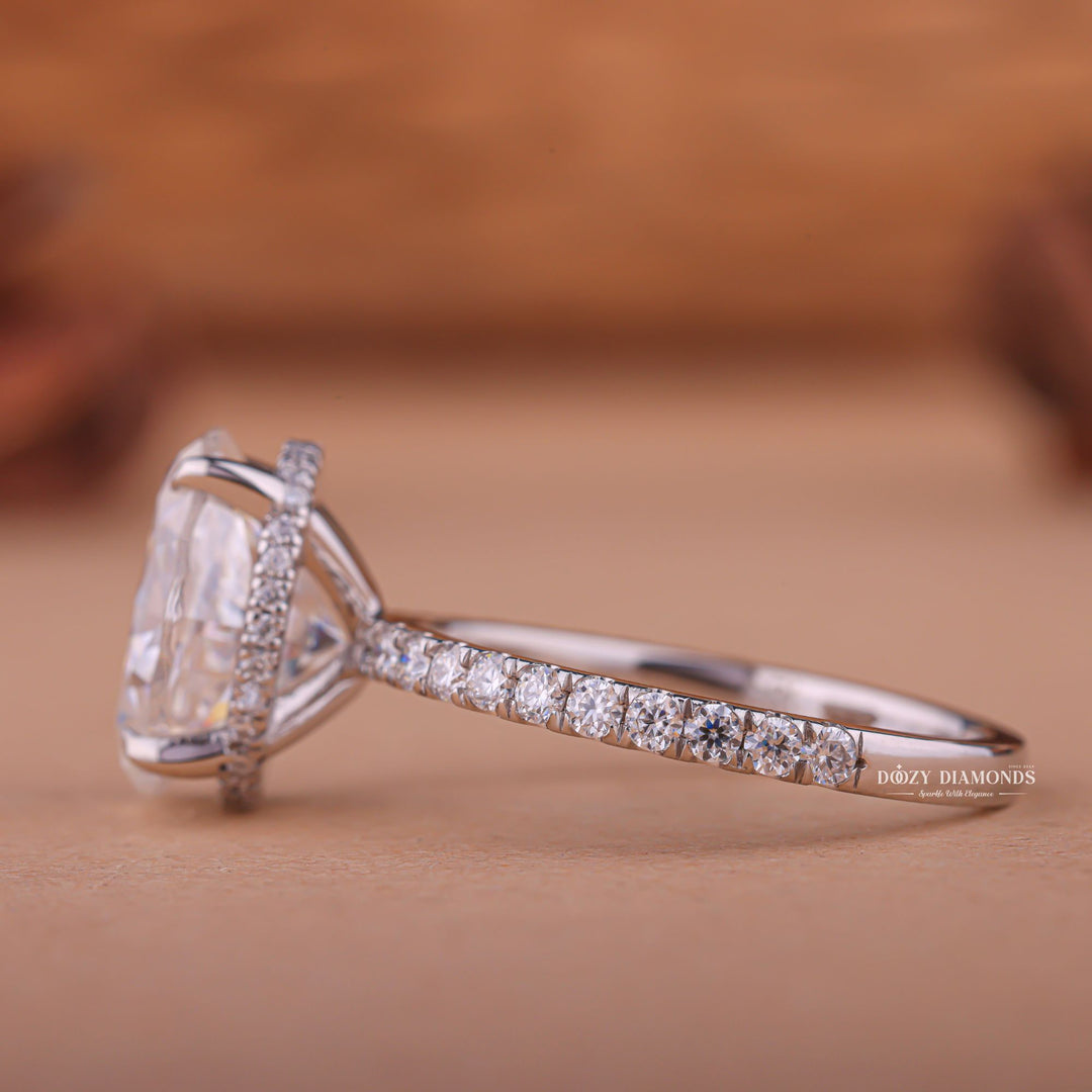 Oval hidden halo engagement ring finished in polished solid gold
