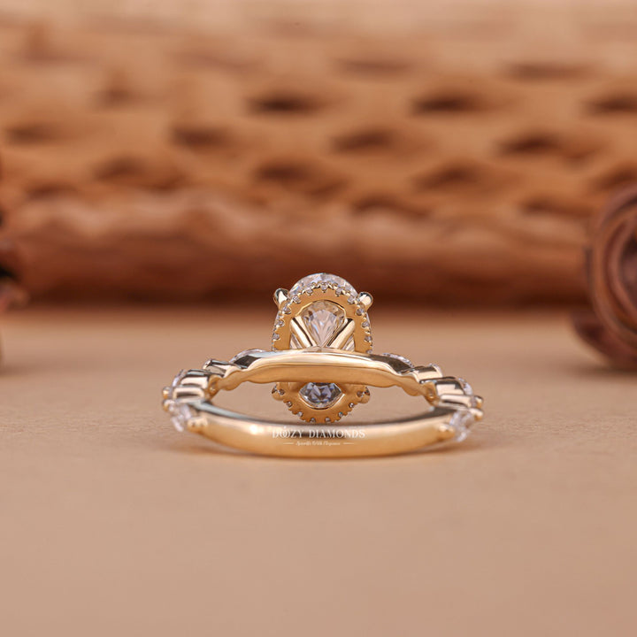 Oval hidden halo engagement ring shown on hand for true-to-life sizing