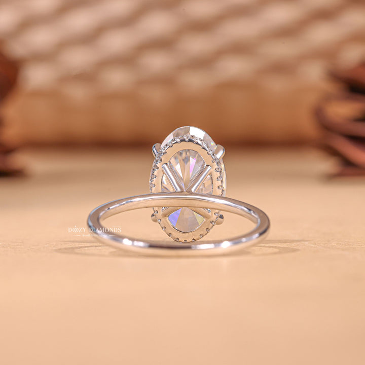Oval hidden halo lab grown diamond ring side profile in gold setting