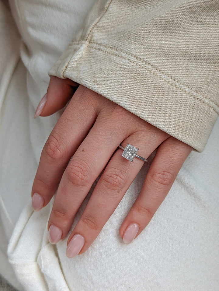 Cushion solitaire diamond ring presented in signature gift packaging