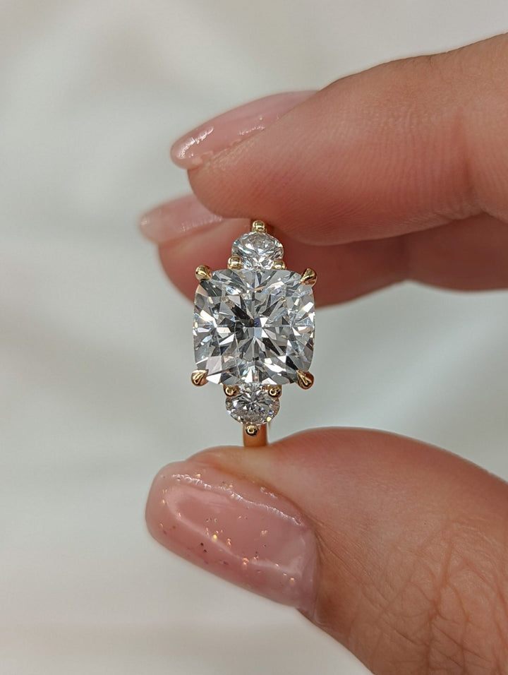 Macro shot of cushion cut diamond facets in solitaire ring setting