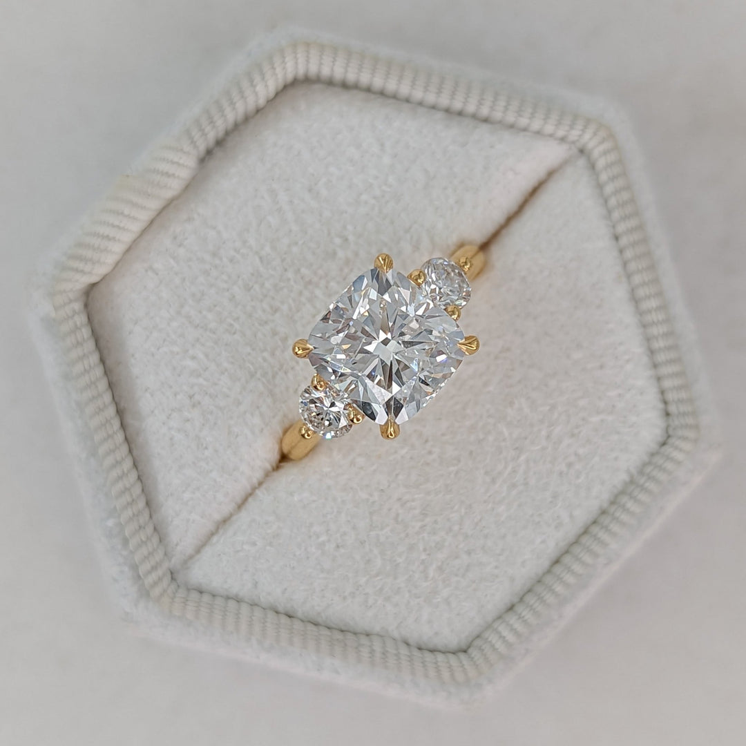 Cushion cut engagement ring side view showing band detail