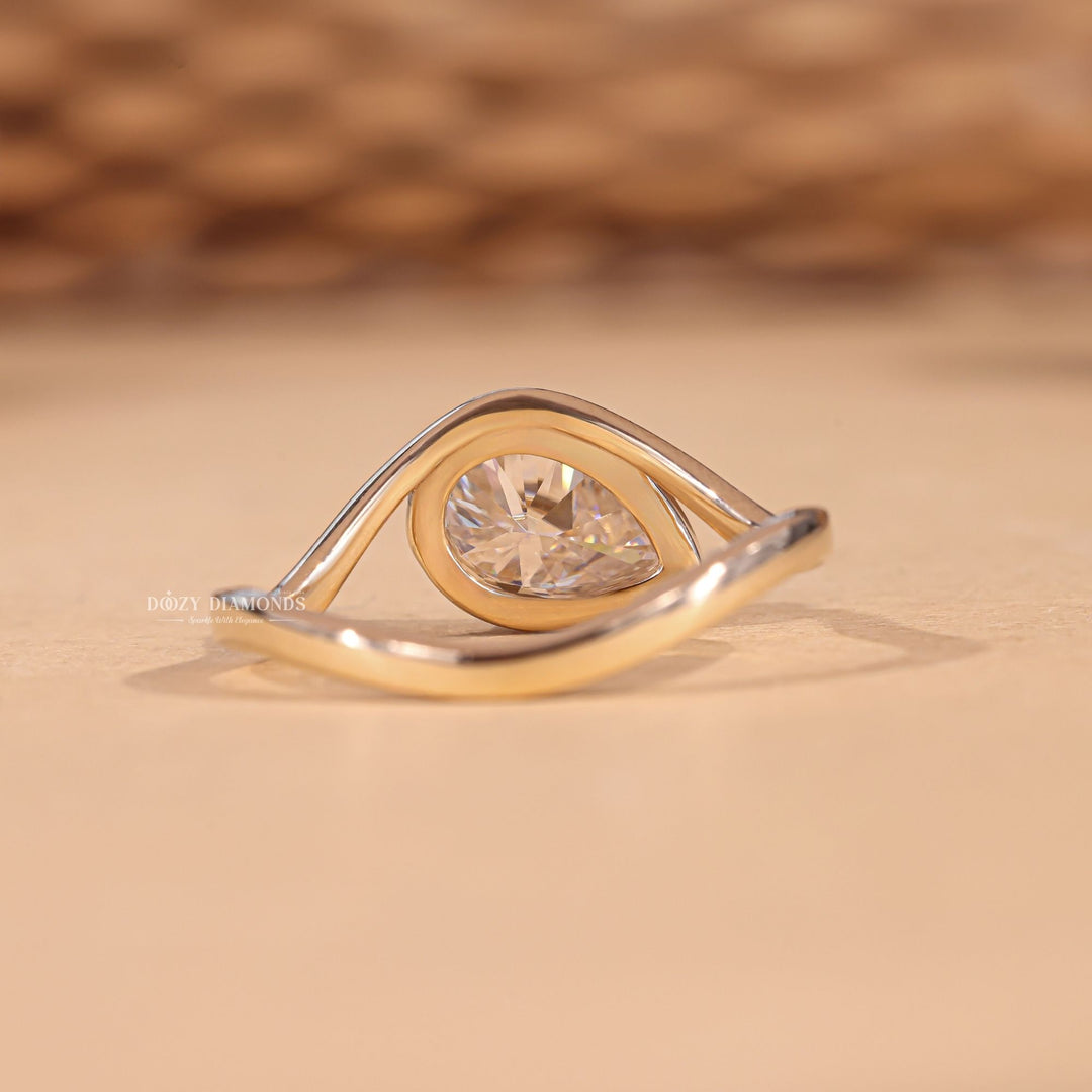 Premium marquise cut bezel engagement ring crafted in solid gold