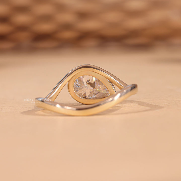 Premium marquise cut bezel engagement ring crafted in solid gold