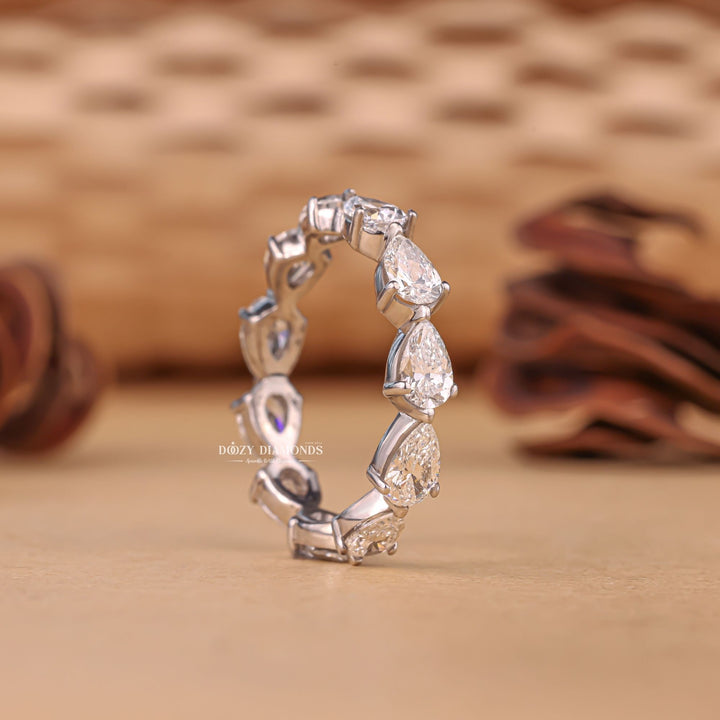 Eternity diamond band stacked with engagement ring