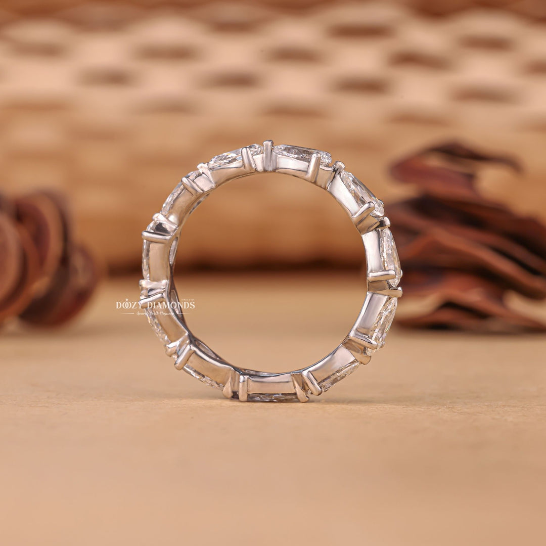 Ethically sourced pear diamond eternity band
