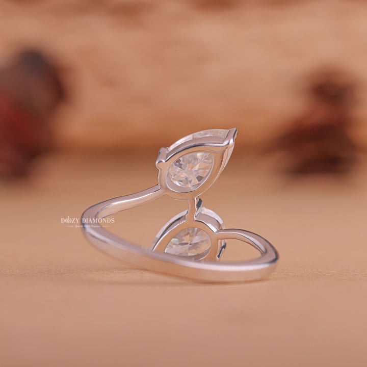Pear cut diamond ring worn on hand