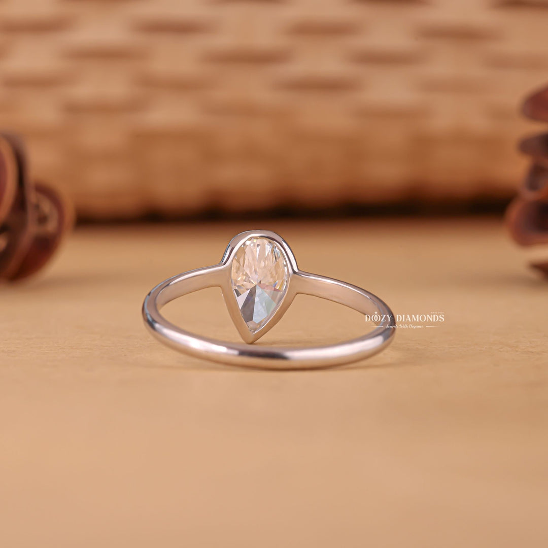 Pear solitaire diamond ring presented in signature gift packaging