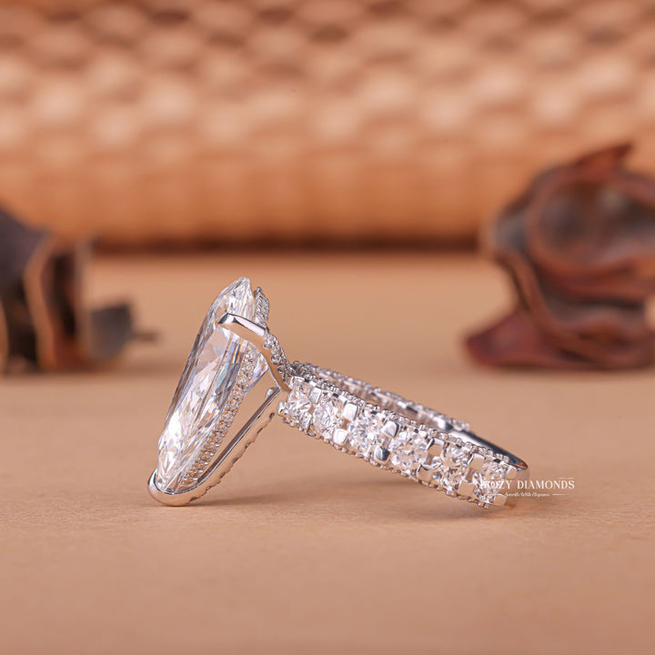 Side angle of pear hidden halo diamond engagement ring
