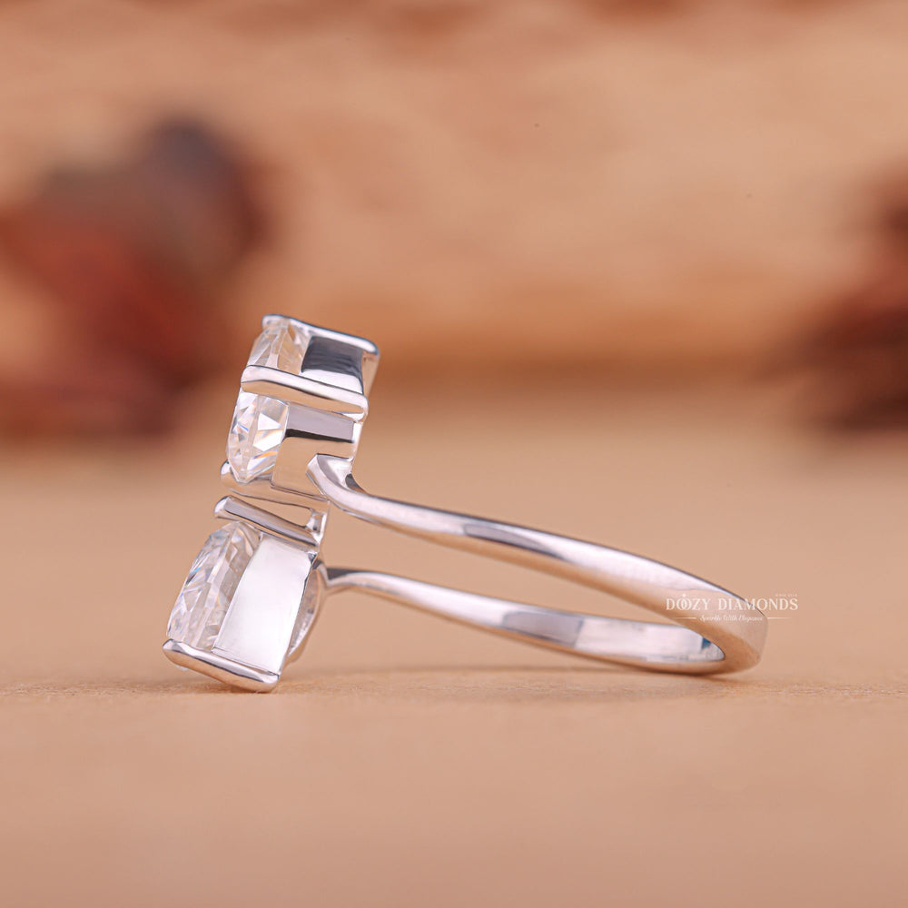 Pear solitaire engagement ring shown on hand for true-to-life sizing