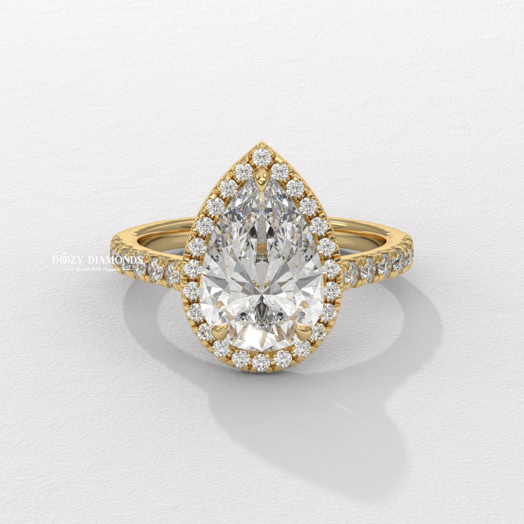 Pear cut halo engagement ring available to buy now