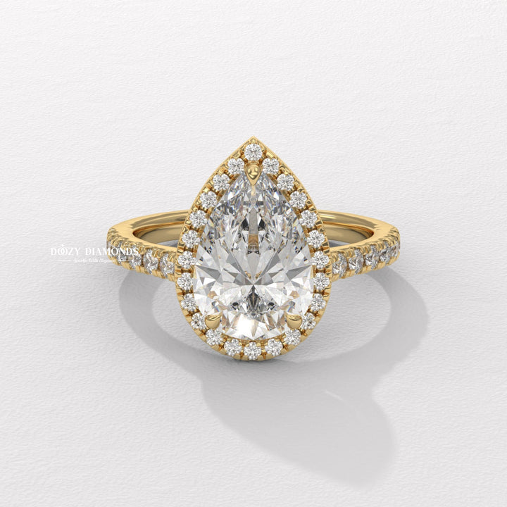 Pear cut halo engagement ring available to buy now