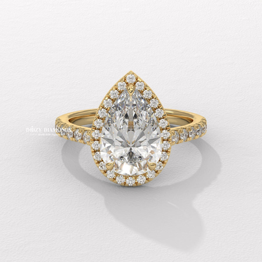 Pear cut halo engagement ring available to buy now
