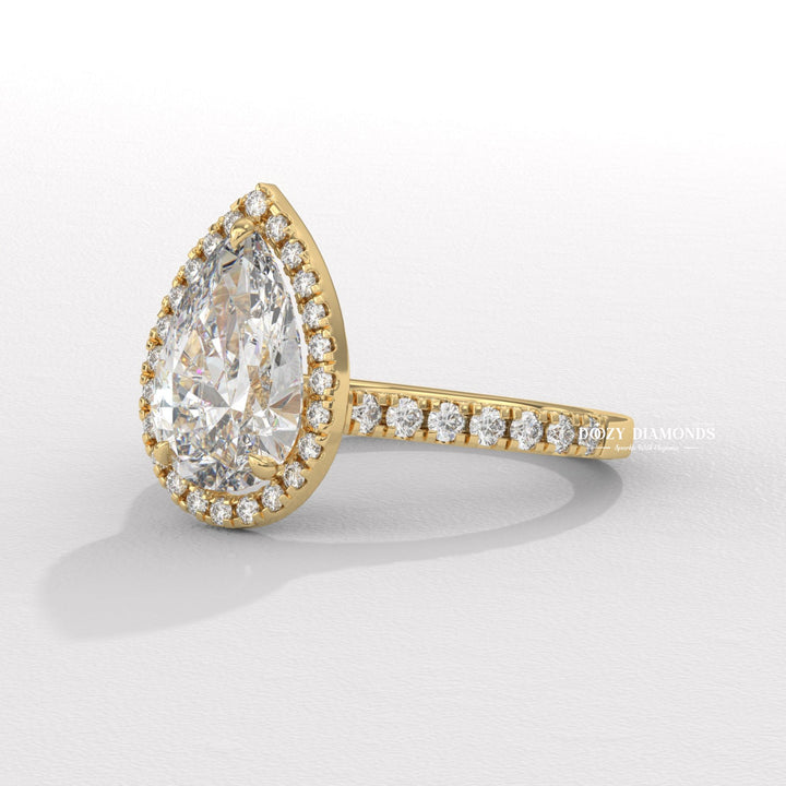 Pear halo engagement ring close-up highlighting diamond sparkle