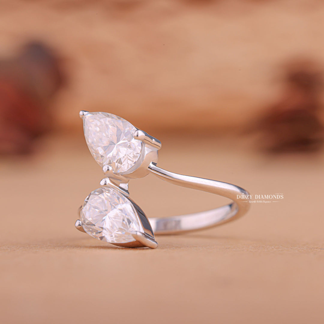 Pear solitaire lab grown diamond ring fitted on finger