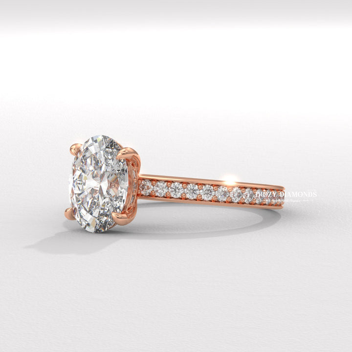 Oval cut diamond ring worn on hand