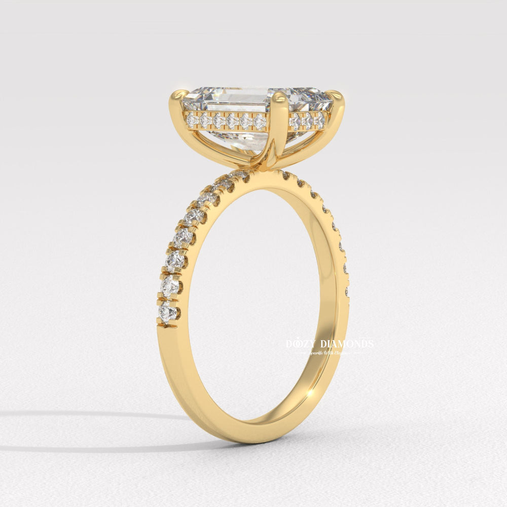 Close-up of emerald cut center diamond in hidden halo engagement ring