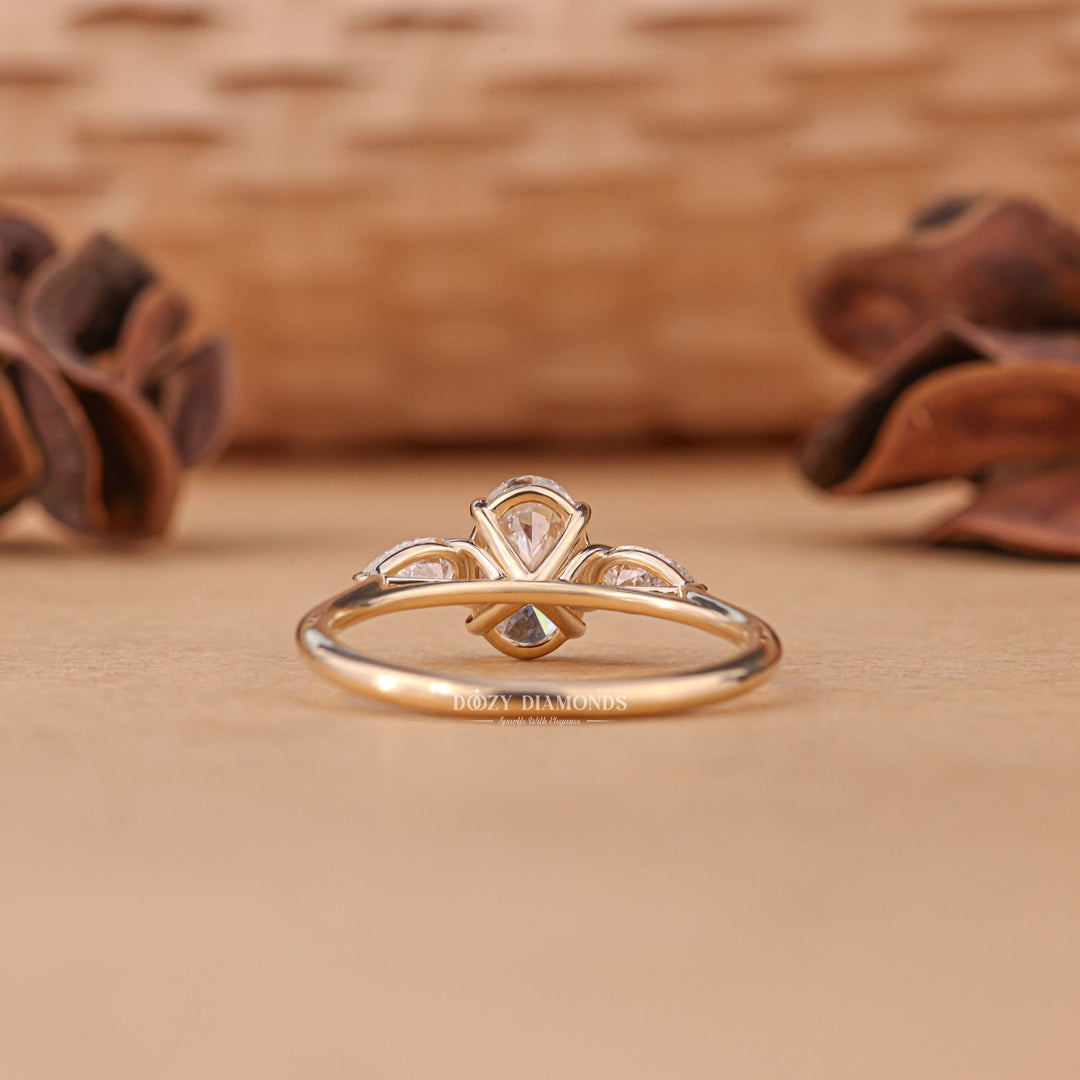 IGI certified oval cut diamond in three stone engagement ring setting