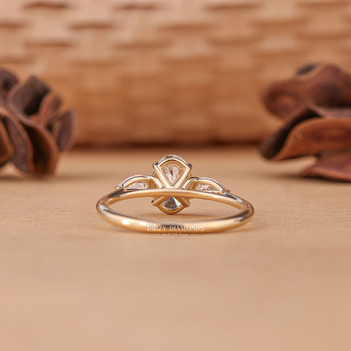 IGI certified oval cut diamond in three stone engagement ring setting