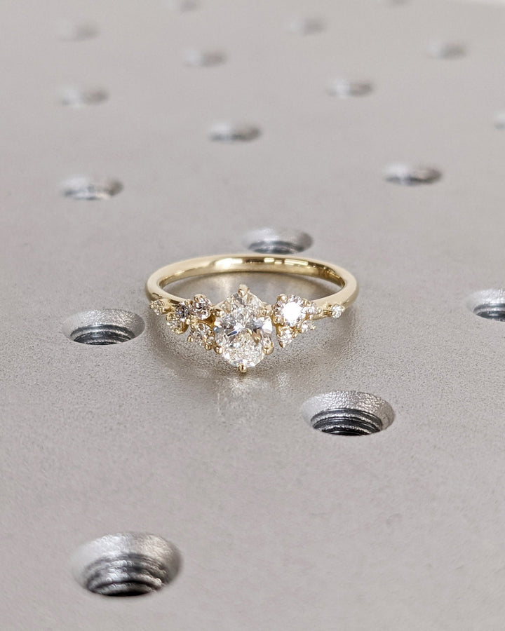 Oval cluster engagement ring with certified lab grown diamond