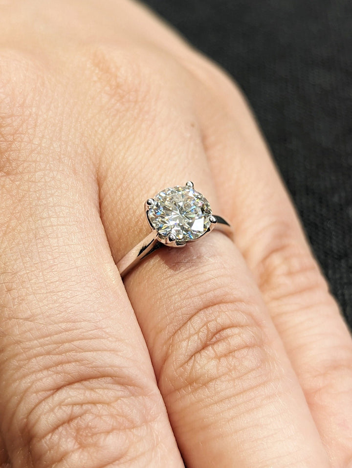 Round solitaire lab grown diamond ring side profile in gold setting