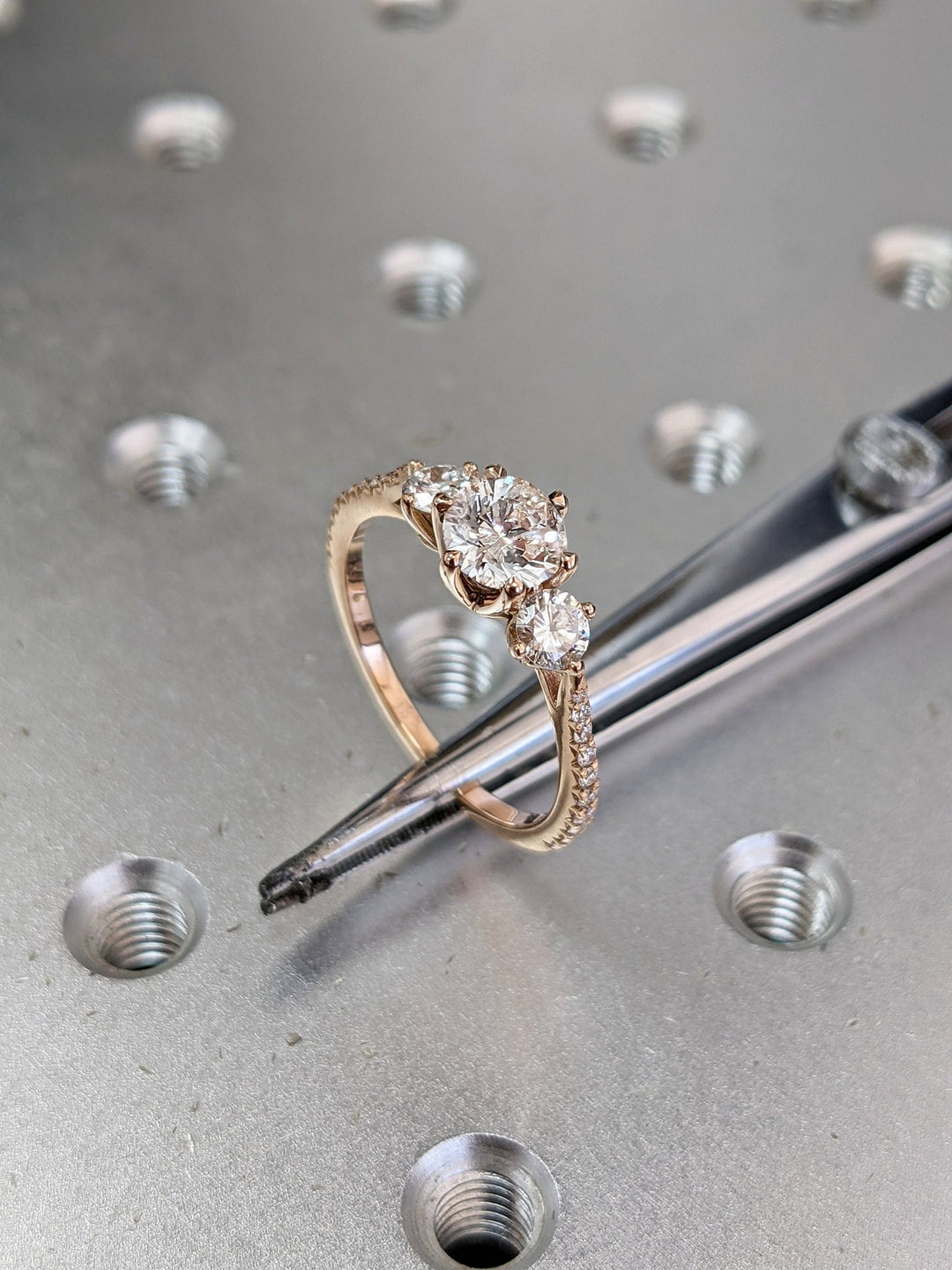 Round solitaire engagement ring shown on hand for true-to-life sizing
