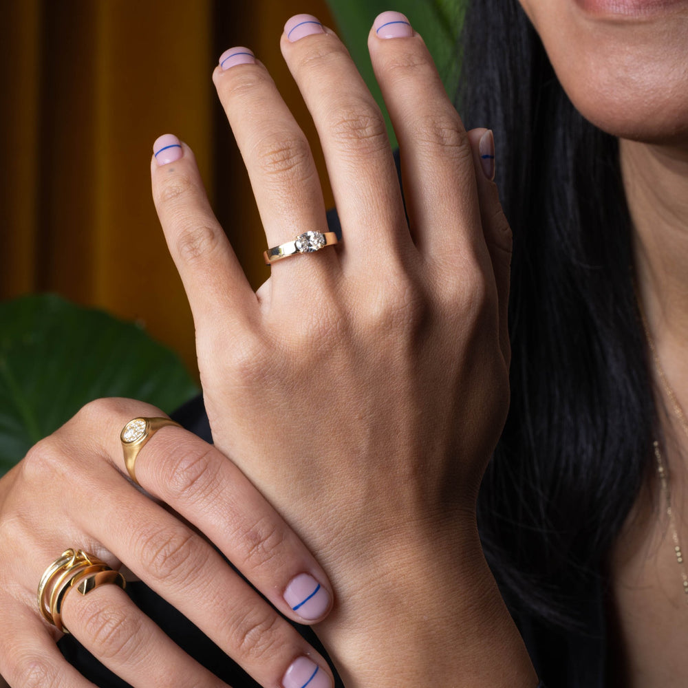 Oval east west lab grown diamond ring side profile in gold setting