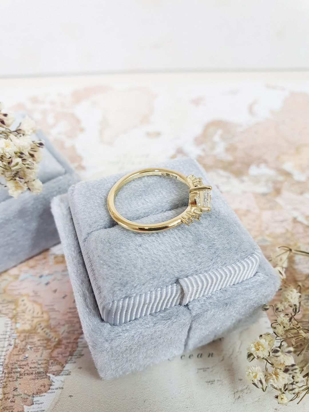 Princess cut cluster engagement ring shown in real-life wear