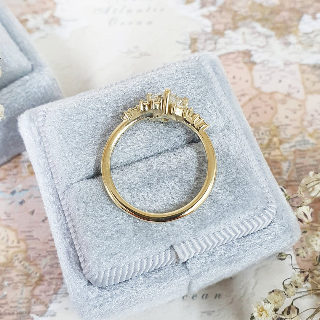Lifestyle shot of princess cluster diamond ring on hand
