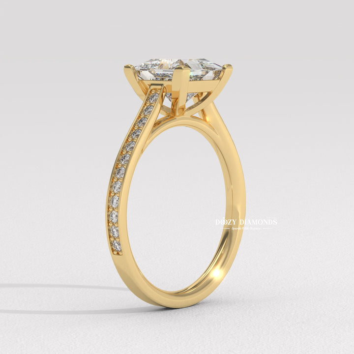 Princess solitaire diamond ring displayed on jewelry stand