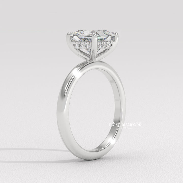 Princess solitaire ring set with an IGI graded diamond