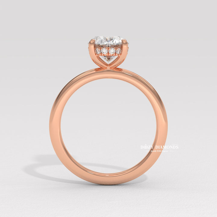 Side angle of oval hidden halo diamond engagement ring