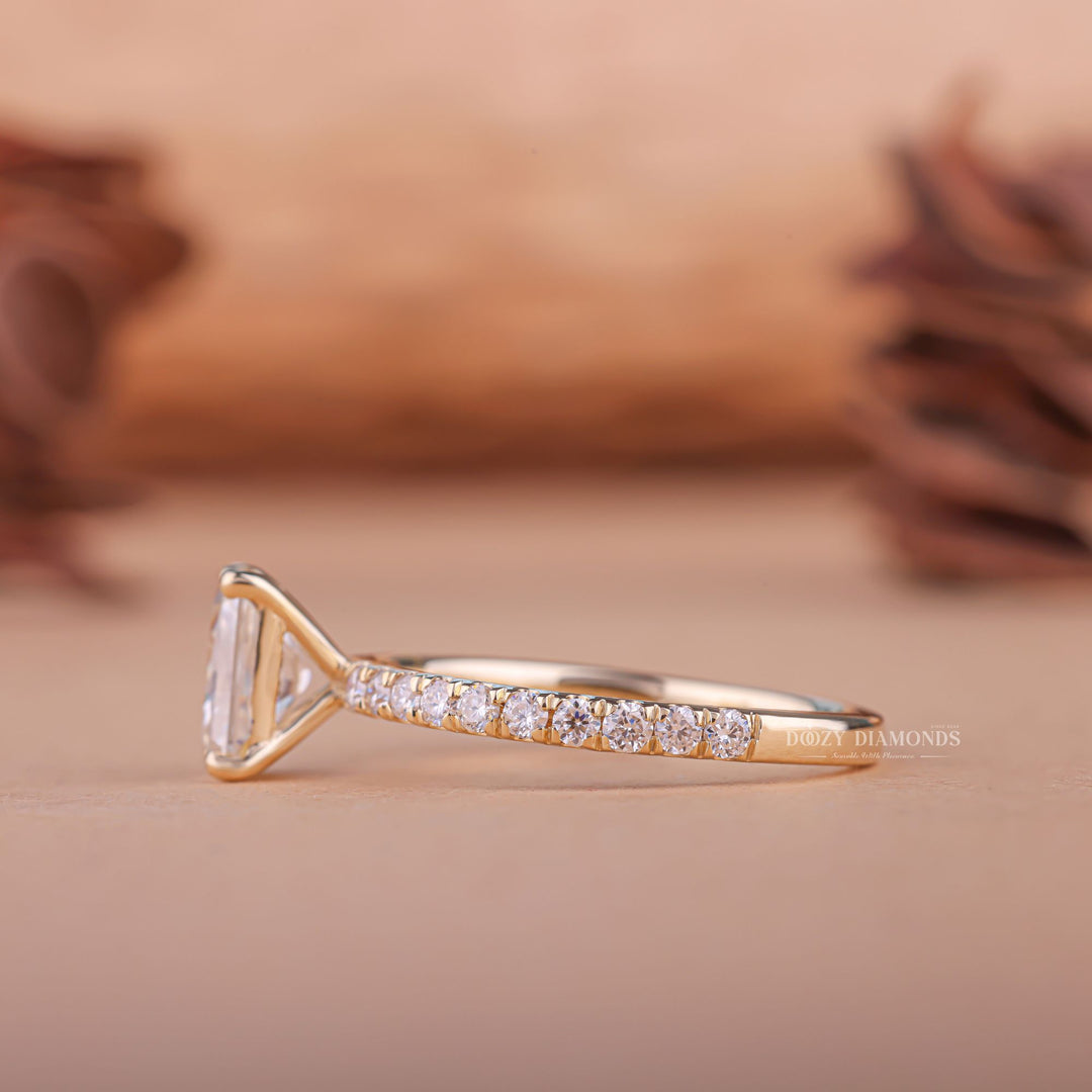 Angled view of radiant cut diamond in pave setting