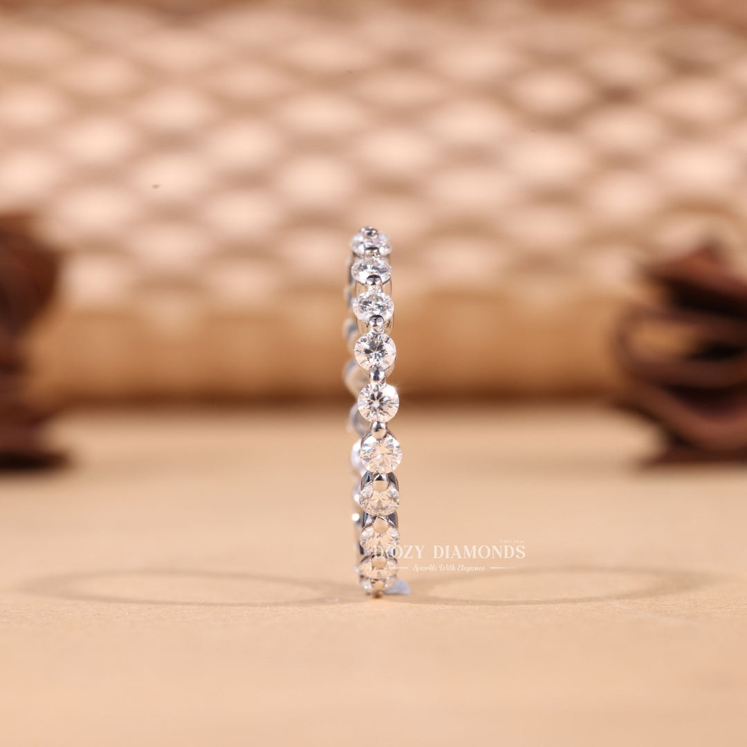 Round diamond band stacked with engagement ring