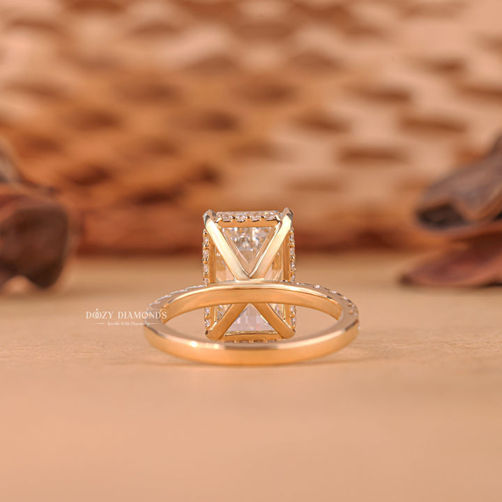 Emerald cut diamond ring worn on hand