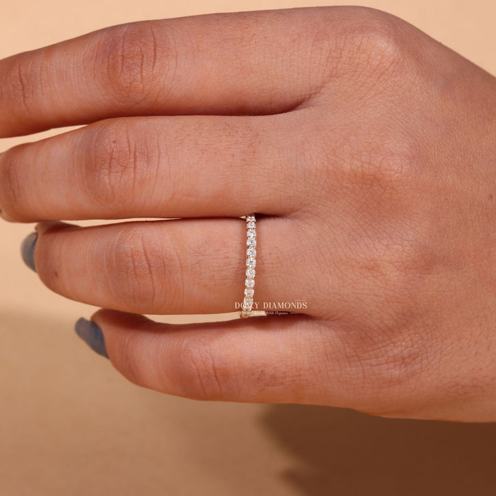 Side view of round diamond wedding band