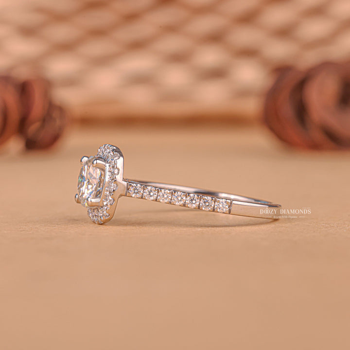 Macro shot of round cut diamond facets in halo ring setting