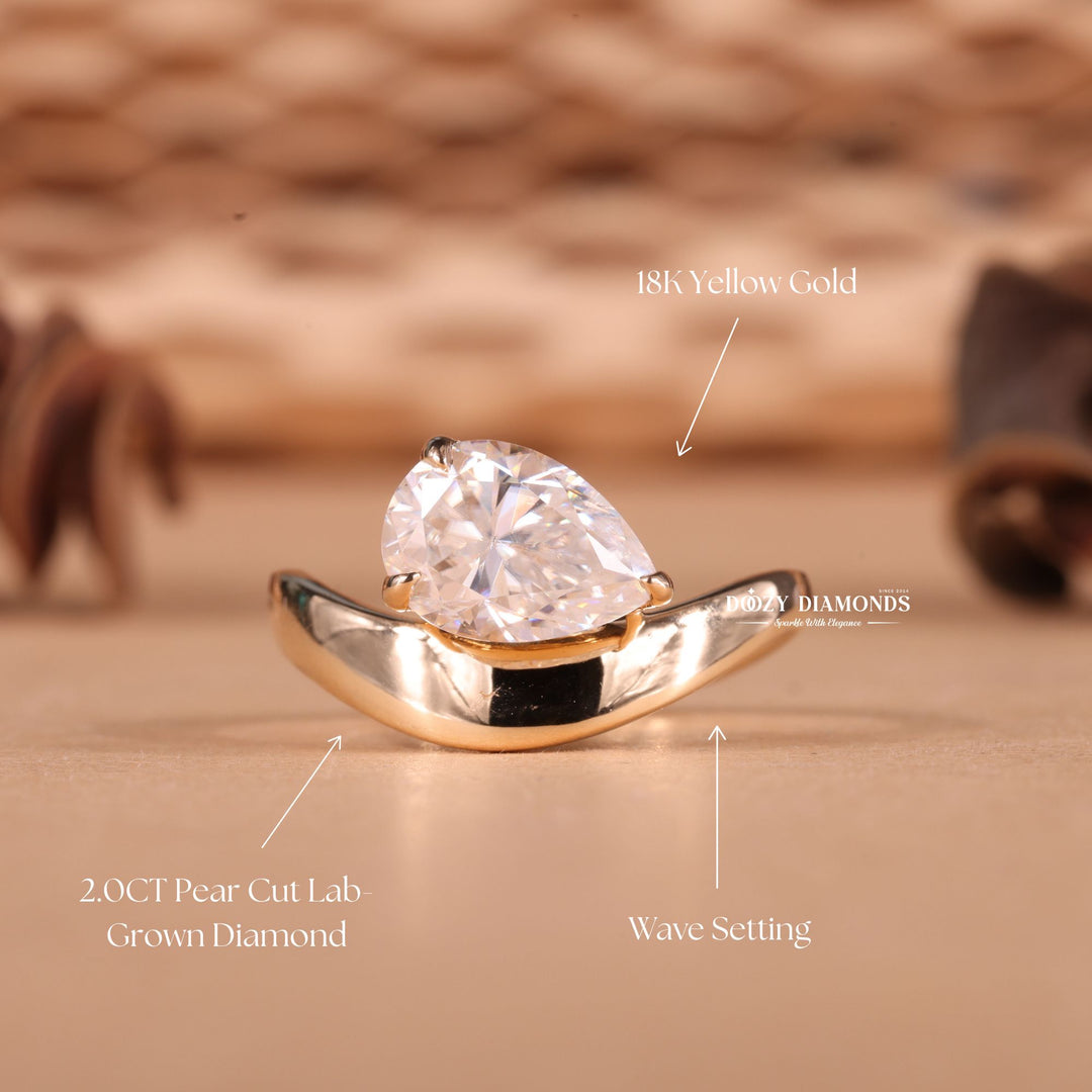 Pear cut east west engagement ring with IGI certified center diamond